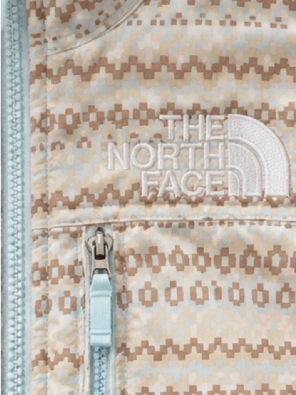 The North Face Youth Cream Fleece Jacket with Tan Pattern & Light Blue Zippers